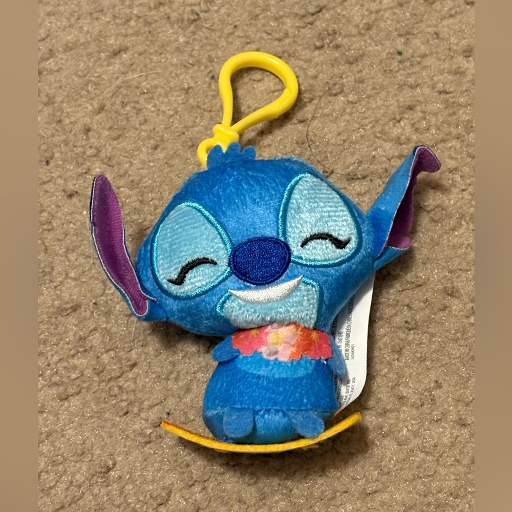 NWT stitch from Lilo and Stitch surfing wearing a flower necklace